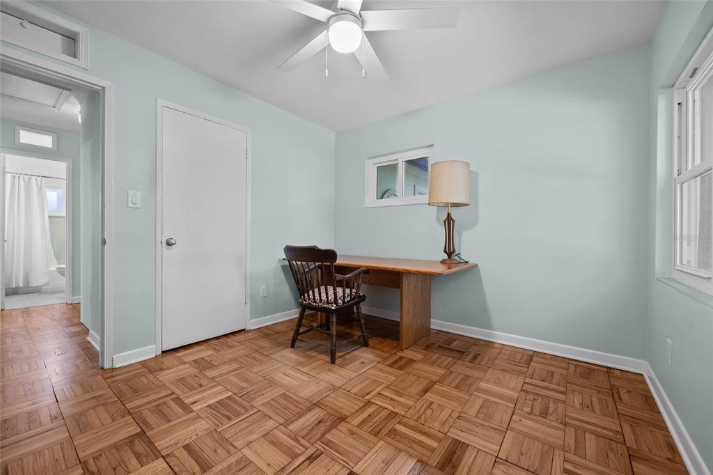 601 Northwest 36th Drive Gainesville, FL 32607 - Photo 22 of 36 a workspace room with furniture and wooden floor