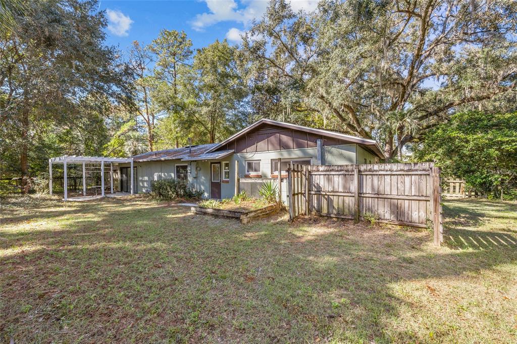 601 Northwest 36th Drive Gainesville, FL 32607 - Photo 25 of 36 a view of a house with a yard
