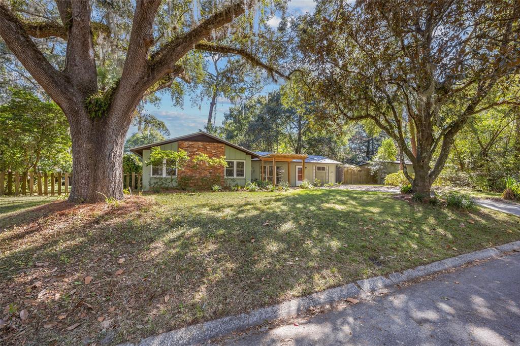 601 Northwest 36th Drive Gainesville, FL 32607 - Photo 27 of 36 a front view of a house with a yard