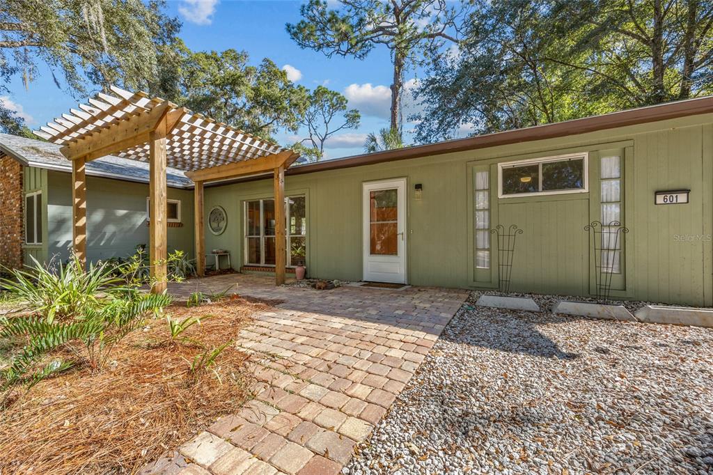 601 Northwest 36th Drive Gainesville, FL 32607 - Photo 28 of 36 a view of a house with a yard