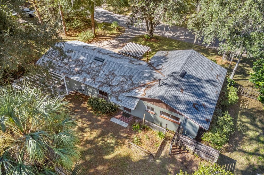601 Northwest 36th Drive Gainesville, FL 32607 - Photo 30 of 36 a view of a yard with plants and large trees