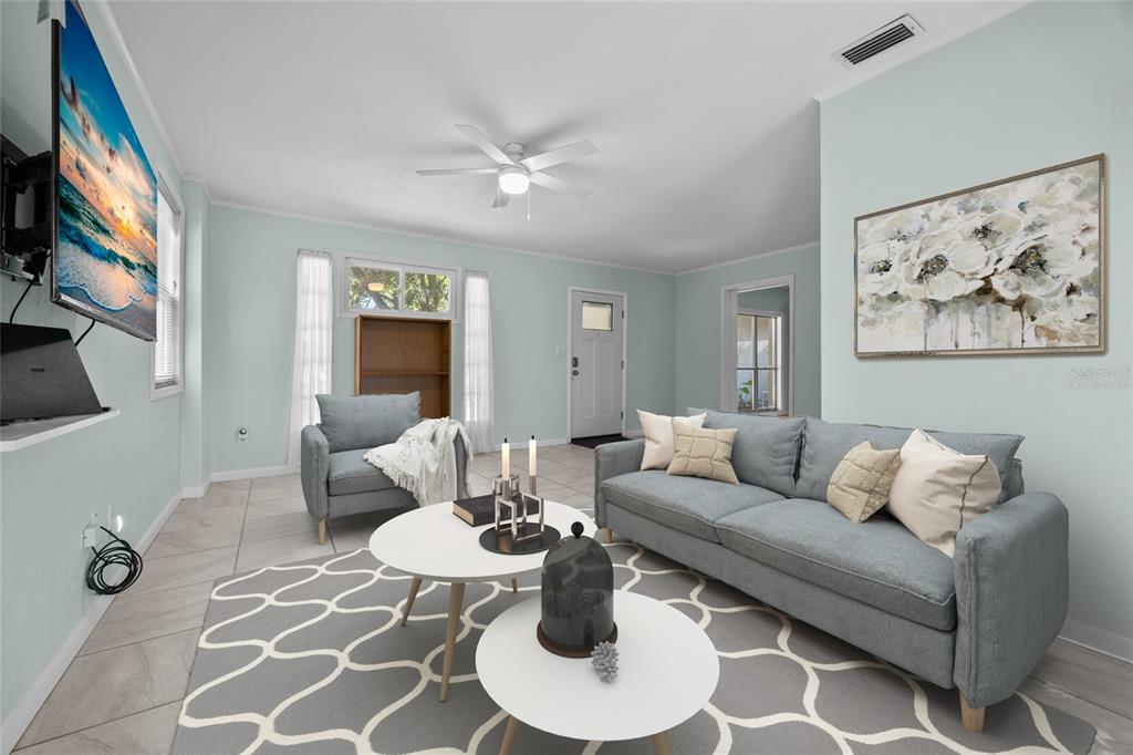 601 Northwest 36th Drive Gainesville, FL 32607 - Photo 3 of 36 a living room with furniture a rug and a painting