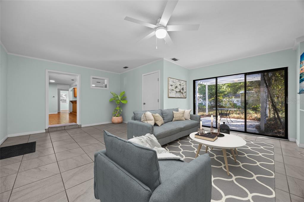 601 Northwest 36th Drive Gainesville, FL 32607 - Photo 4 of 36 a living room with furniture and a large window