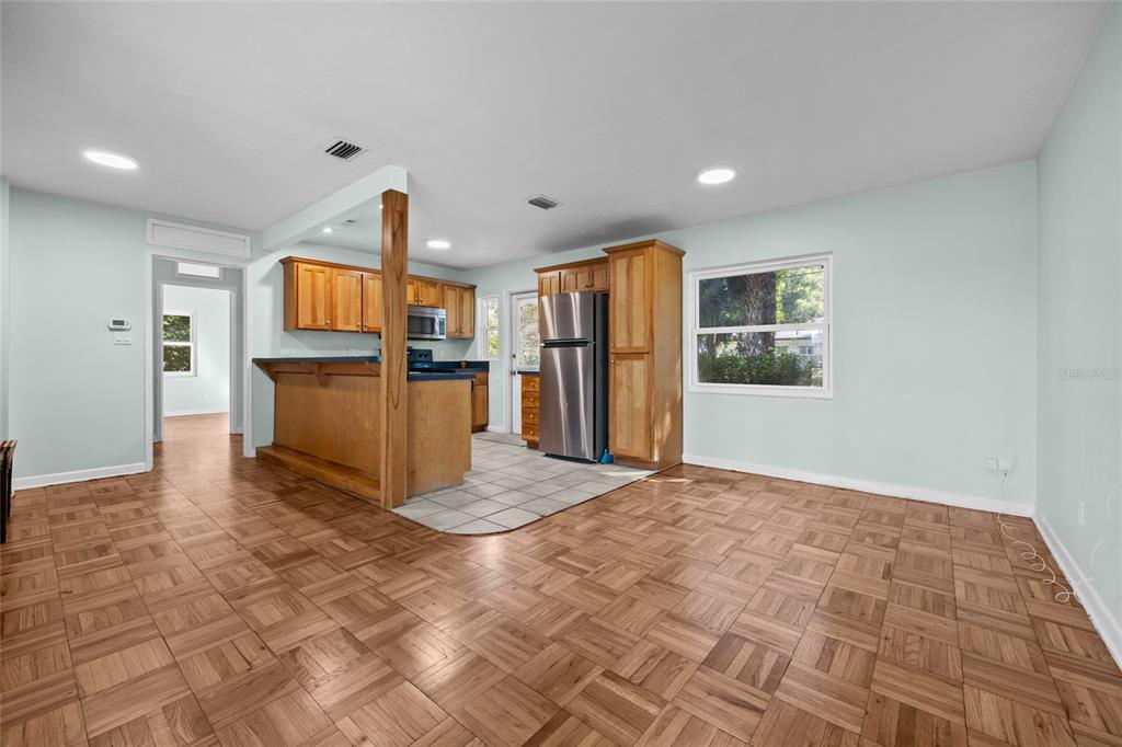 601 Northwest 36th Drive Gainesville, FL 32607 - Photo 9 of 36 a view of kitchen with furniture and refrigerator
