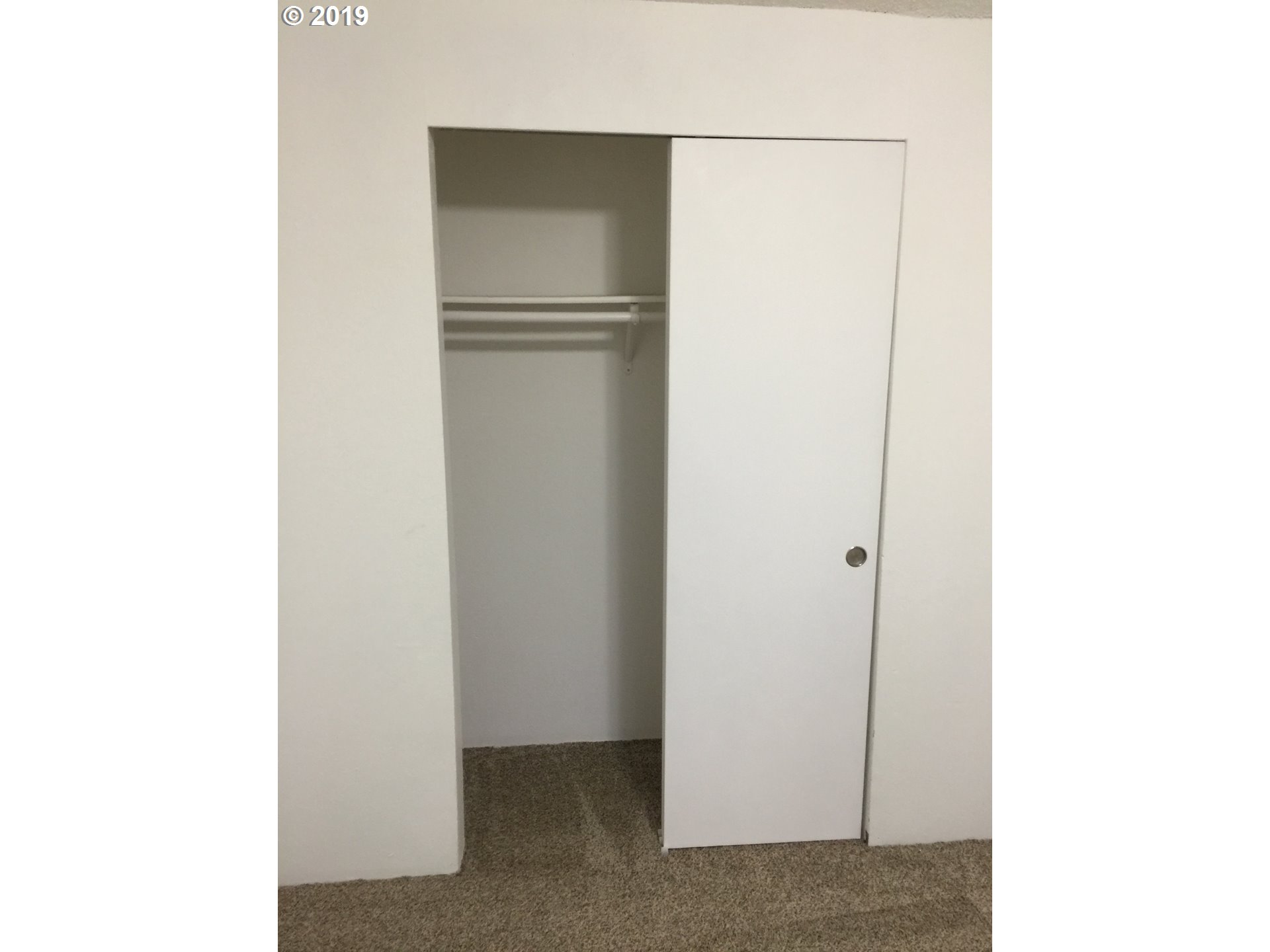 9733 Southeast Foster Road Portland, OR 97266 - Photo 15 of 16 a view of a room with a refrigerator