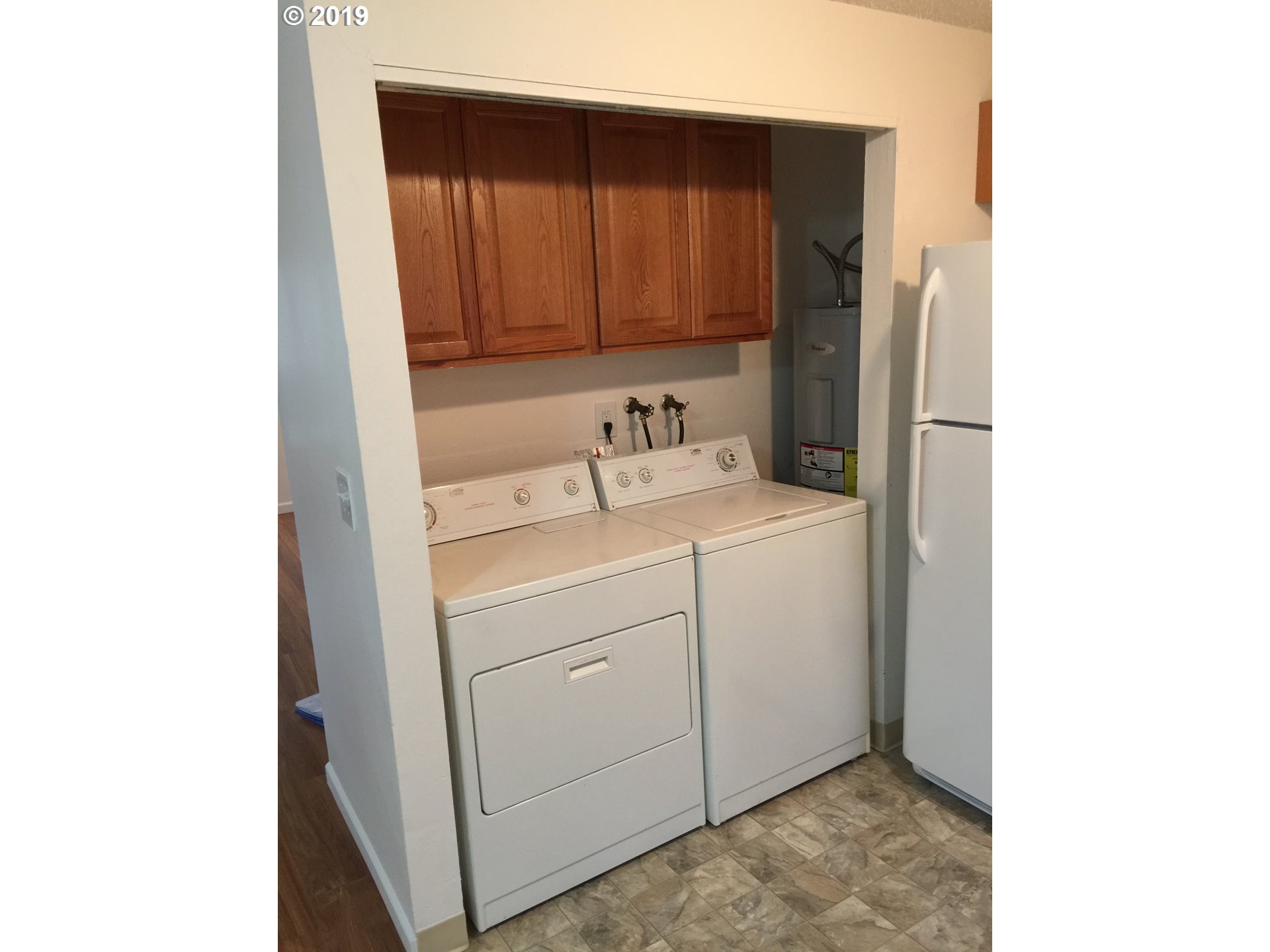 9733 Southeast Foster Road Portland, OR 97266 - Photo 8 of 16 a utility room with dryer and washer
