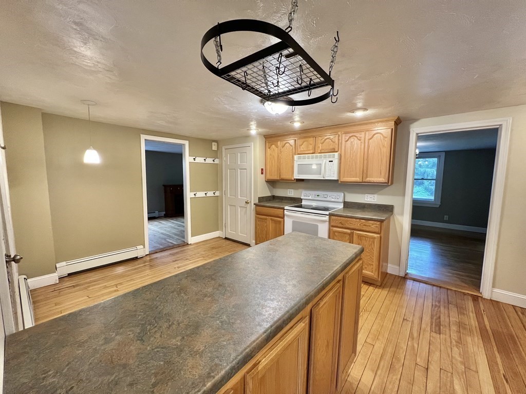 199 Main Street Rutland, MA 01543 - Photo 8 of 39 a view of a kitchen with a sink and cabinets