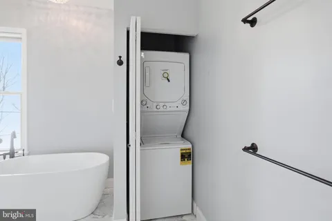 a bathroom with a bathtub and toilet