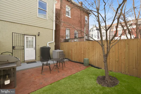 a view of yard with patio