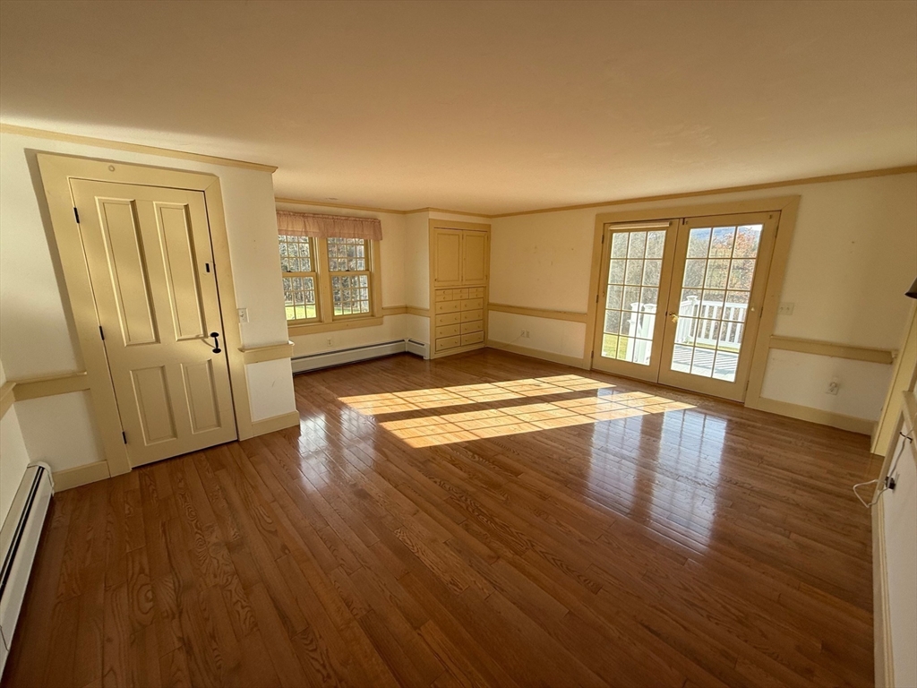 94 West Princeton Road Westminster, MA 01473 - Photo 11 of 26 an empty room with wooden floor and windows