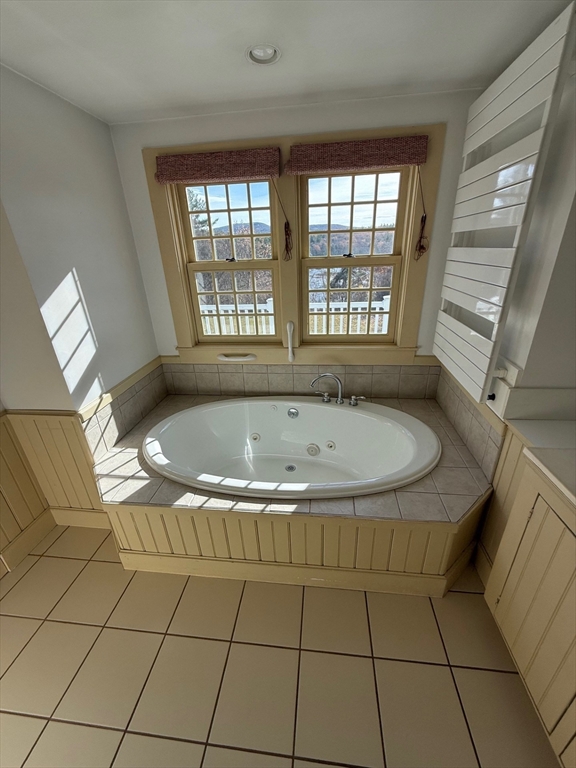 94 West Princeton Road Westminster, MA 01473 - Photo 14 of 26 a bath tub sitting in a bathroom next to a window