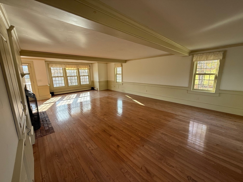 94 West Princeton Road Westminster, MA 01473 - Photo 6 of 26 an empty room with wooden floor and windows