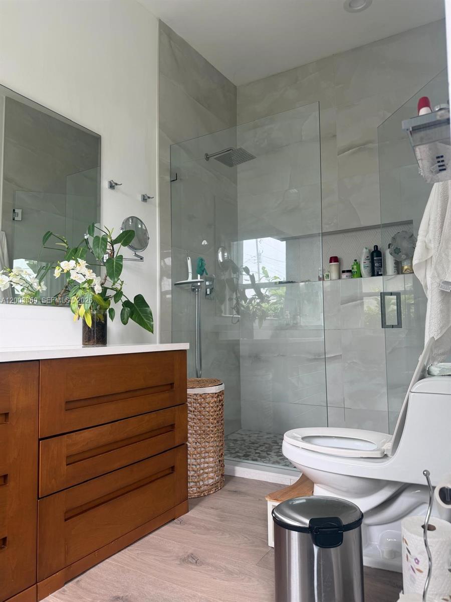 1251 Southwest 11th Terrace Boca Raton, FL 33486 - Photo 19 of 47 a bathroom with a sink and toilet