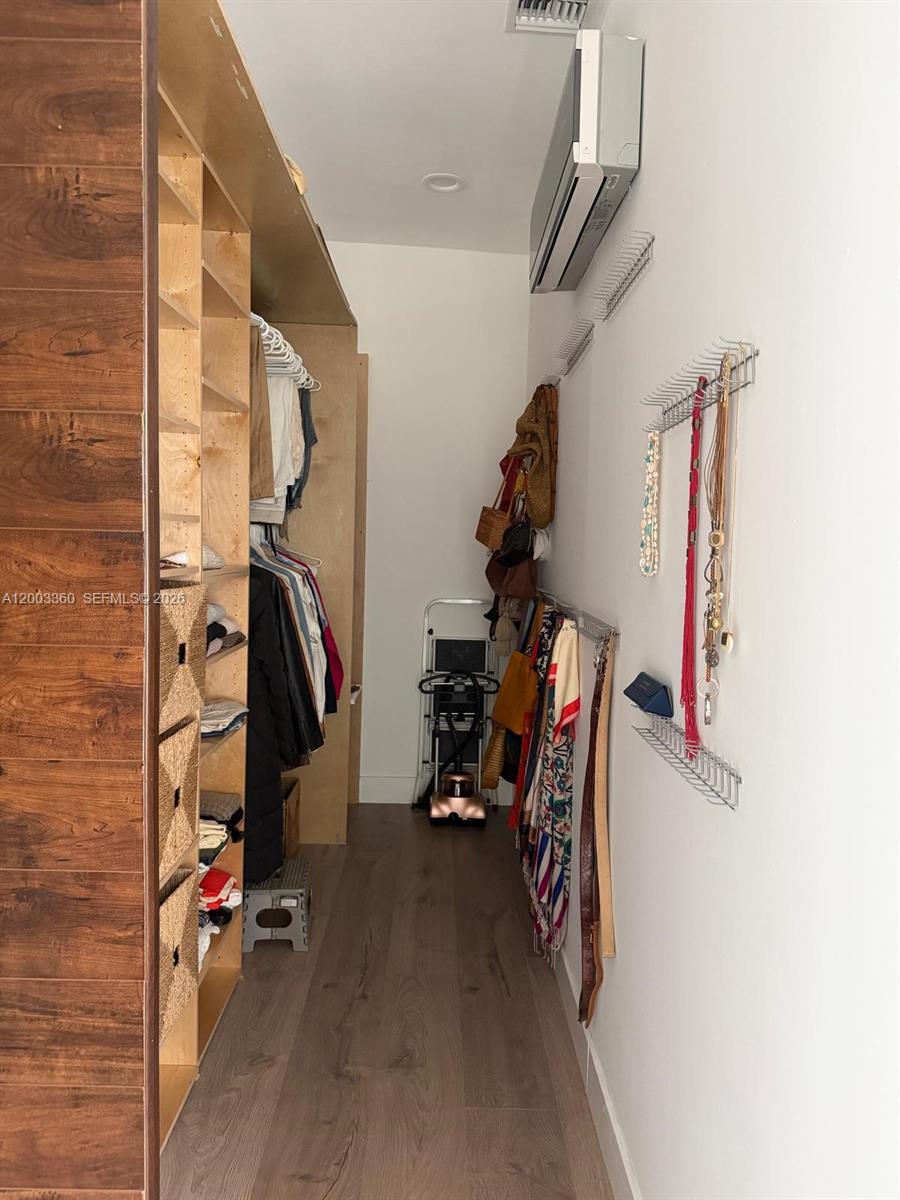1251 Southwest 11th Terrace Boca Raton, FL 33486 - Photo 20 of 47 a view of walk in closet with clothes