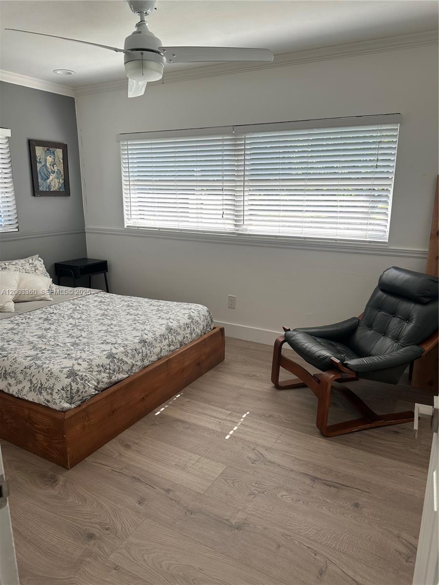 1251 Southwest 11th Terrace Boca Raton, FL 33486 - Photo 28 of 47 a bedroom with a bed and window