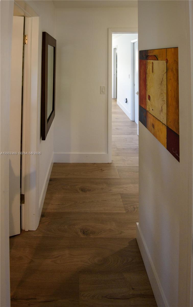 1251 Southwest 11th Terrace Boca Raton, FL 33486 - Photo 32 of 47 a view of hallway with wooden floor