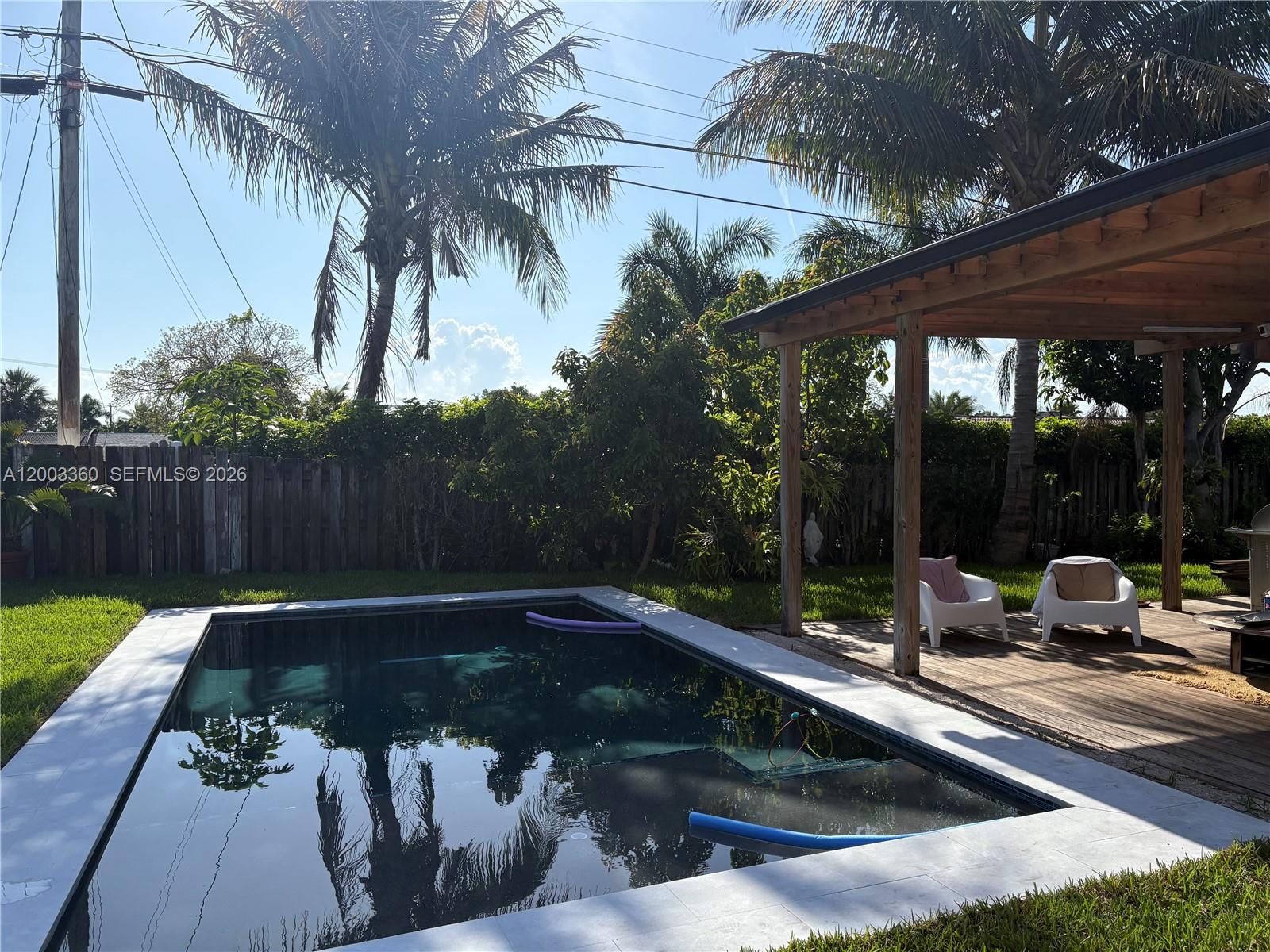1251 Southwest 11th Terrace Boca Raton, FL 33486 - Photo 33 of 47 a view of a couches in patio with a backyard