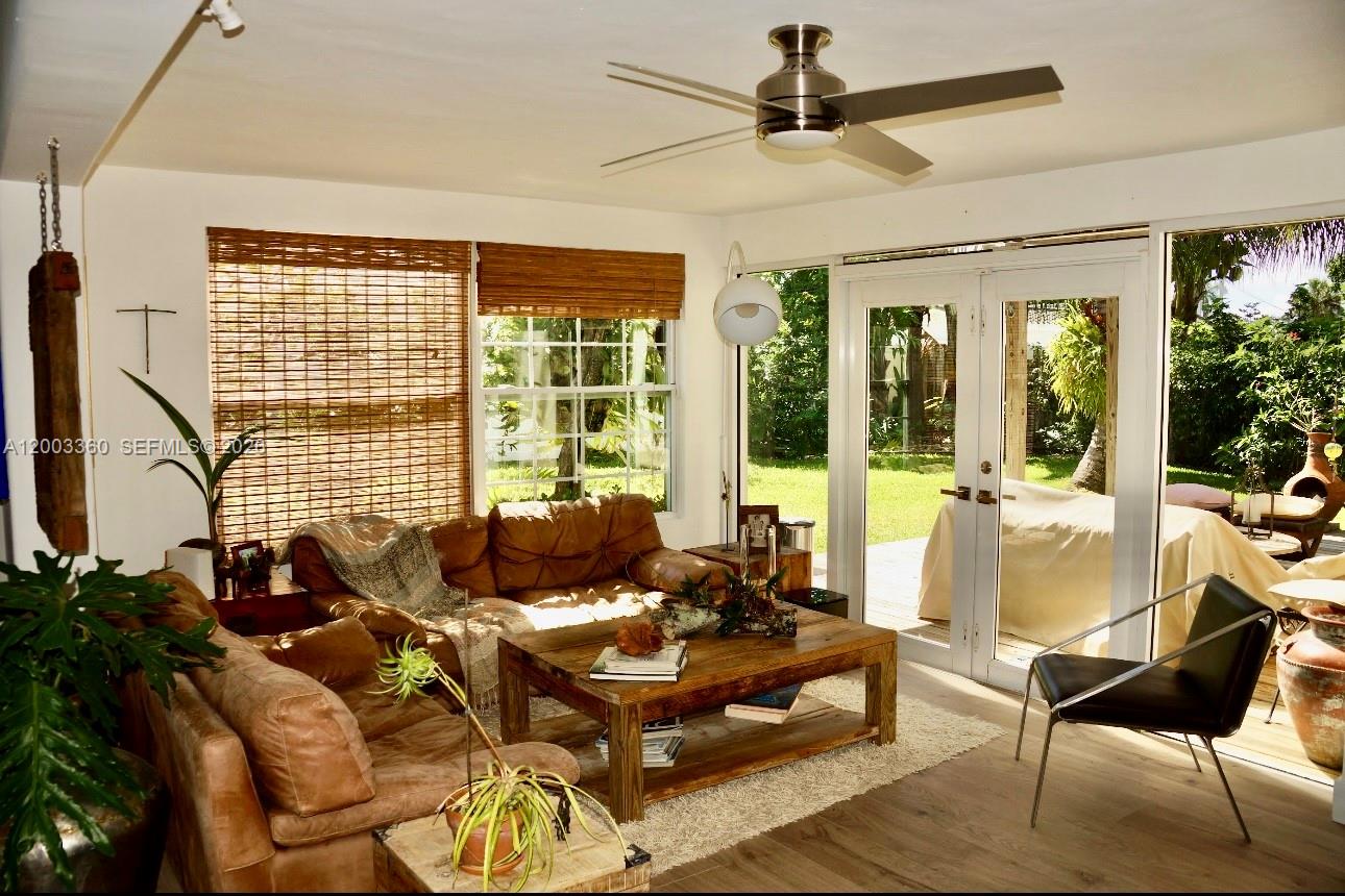 1251 Southwest 11th Terrace Boca Raton, FL 33486 - Photo 8 of 47 a living room with furniture and a large window