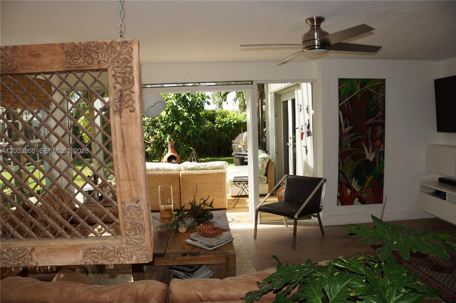 1251 Southwest 11th Terrace Boca Raton, FL 33486 - Photo 10 of 47 a living room with furniture and a potted plant