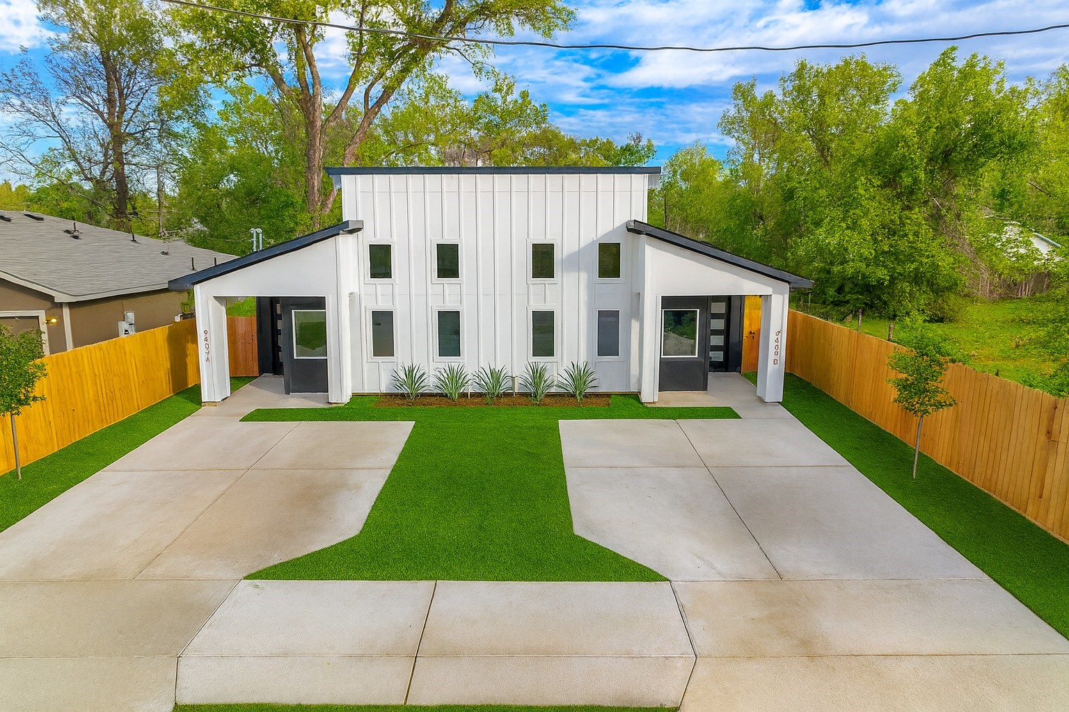 a view of house with a yard