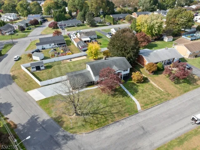 an aerial view of a house with outdoor space