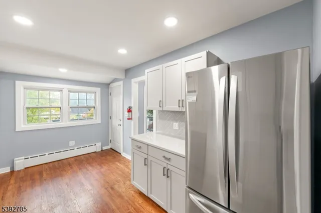 a bathroom with a double vanity sink and a bathtub