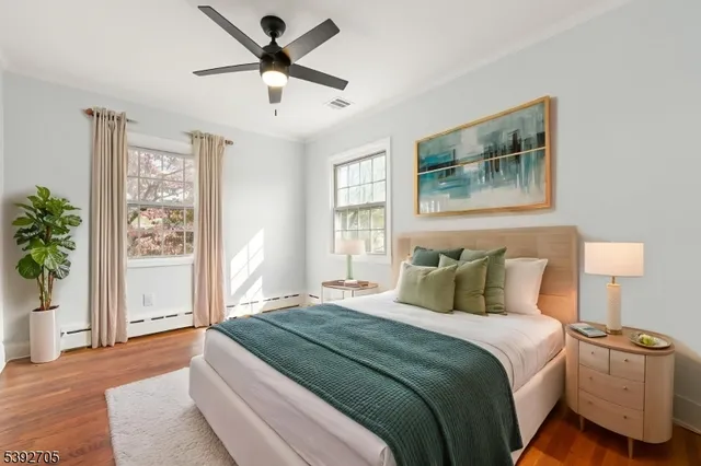 a bedroom with a large bed and a window