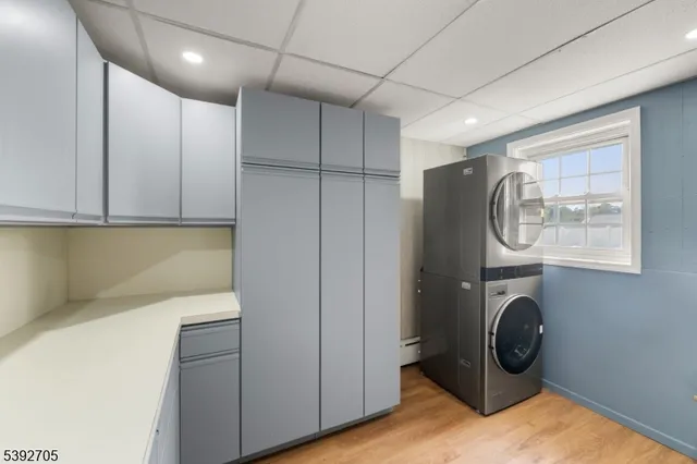 a view of water heater room with washer and dryer