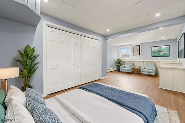 a bedroom with a large bed and a couch