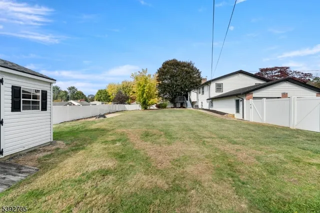 a view of a backyard of the house