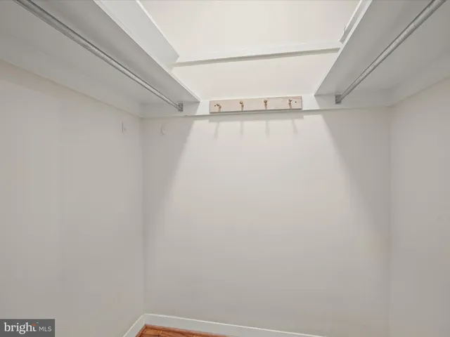 a balcony with furniture and a potted plant