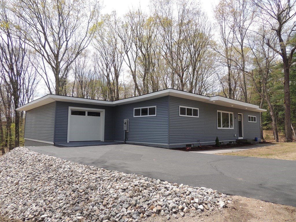 214 Wilbraham Road Monson, MA 01057 - Photo 1 of 38 a front view of a house with a yard
