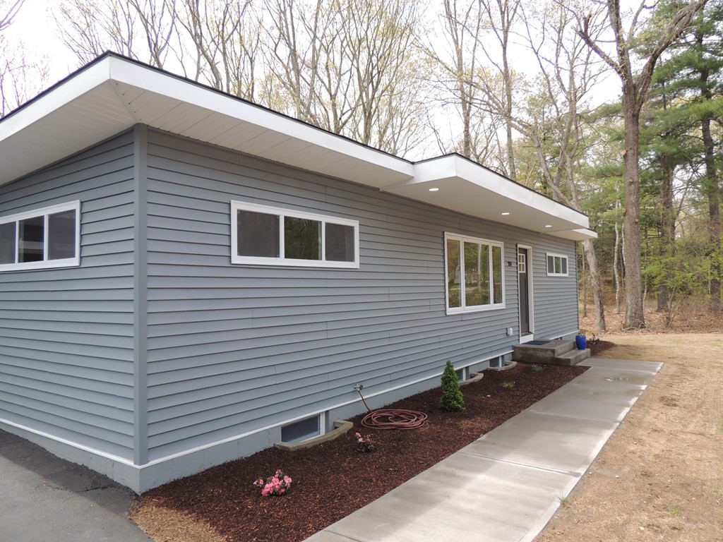 214 Wilbraham Road Monson, MA 01057 - Photo 8 of 38 a front view of a house with a yard