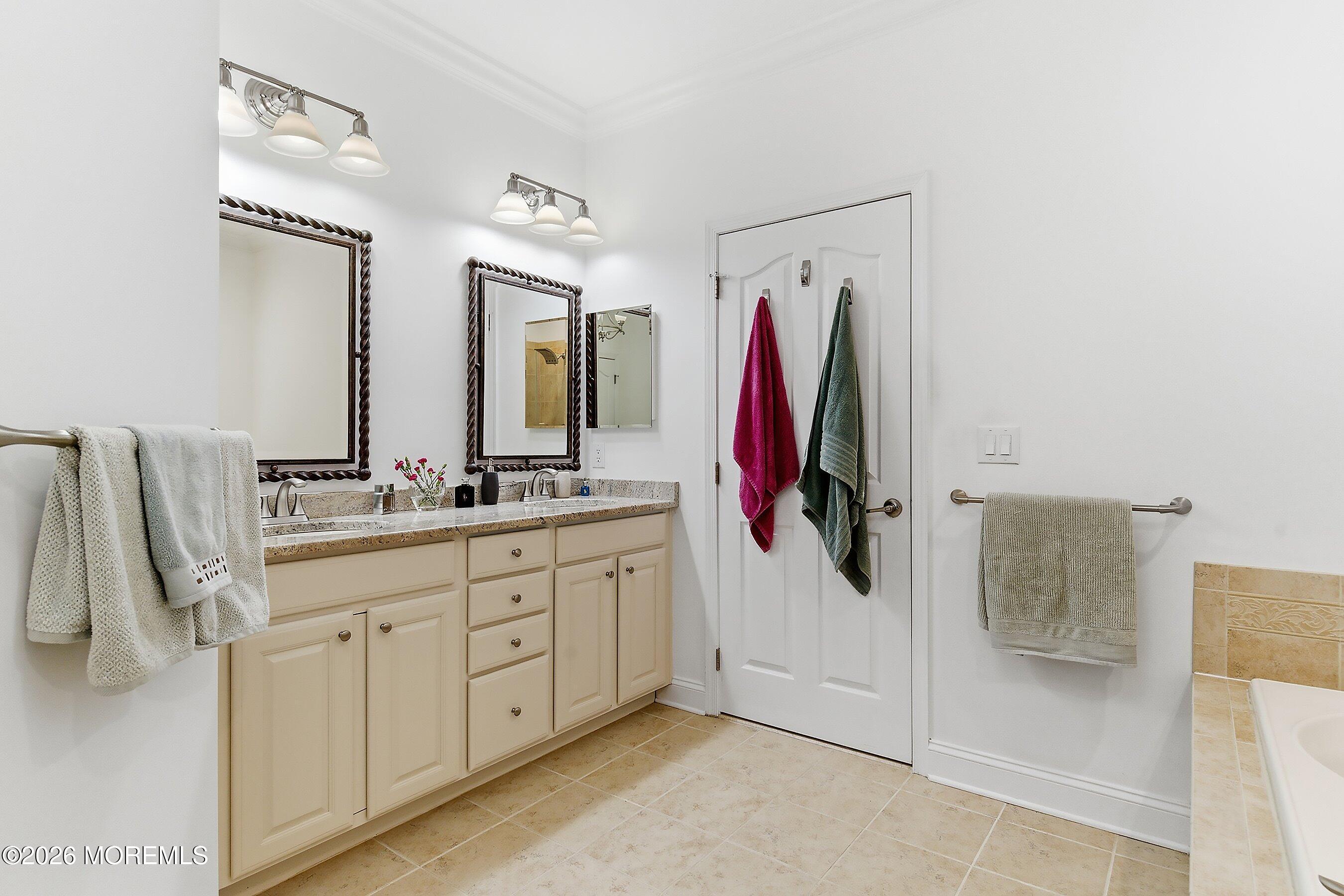 9 Margate Way Waretown, NJ 08758 - Photo 29 of 59 a bathroom with a double vanity sink and a mirror
