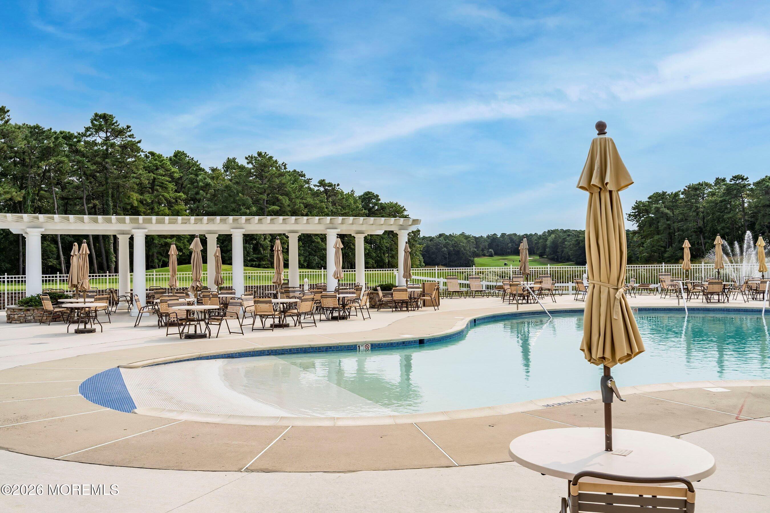 9 Margate Way Waretown, NJ 08758 - Photo 55 of 59 a view of a house with swimming pool and sitting area