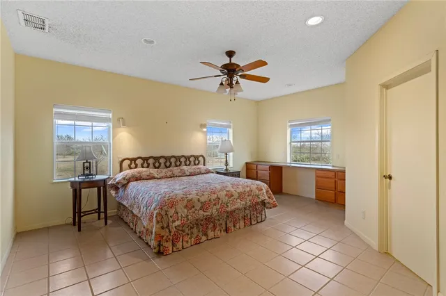 a view of a roof deck with table and chairs with wooden floor