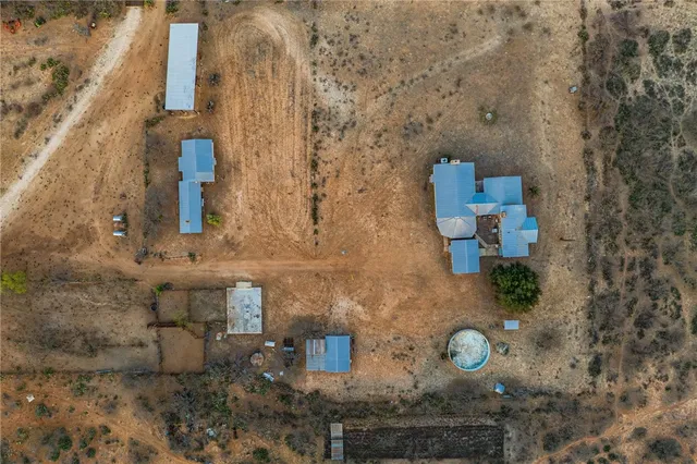 an aerial view of a houses with a lake view