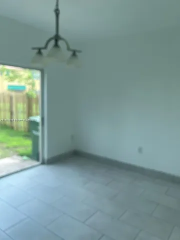 a view of an empty room with a balcony