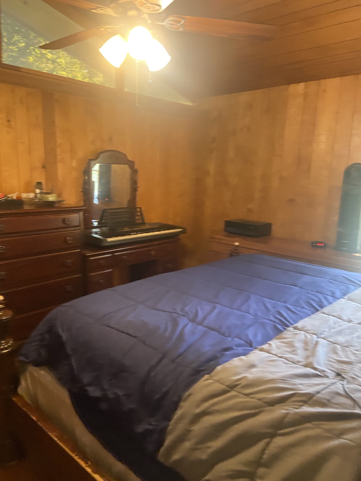 1071 Simms Heights Road Kingston Springs, TN 37082 - Photo 12 of 31 a bedroom with a bed and wooden floor