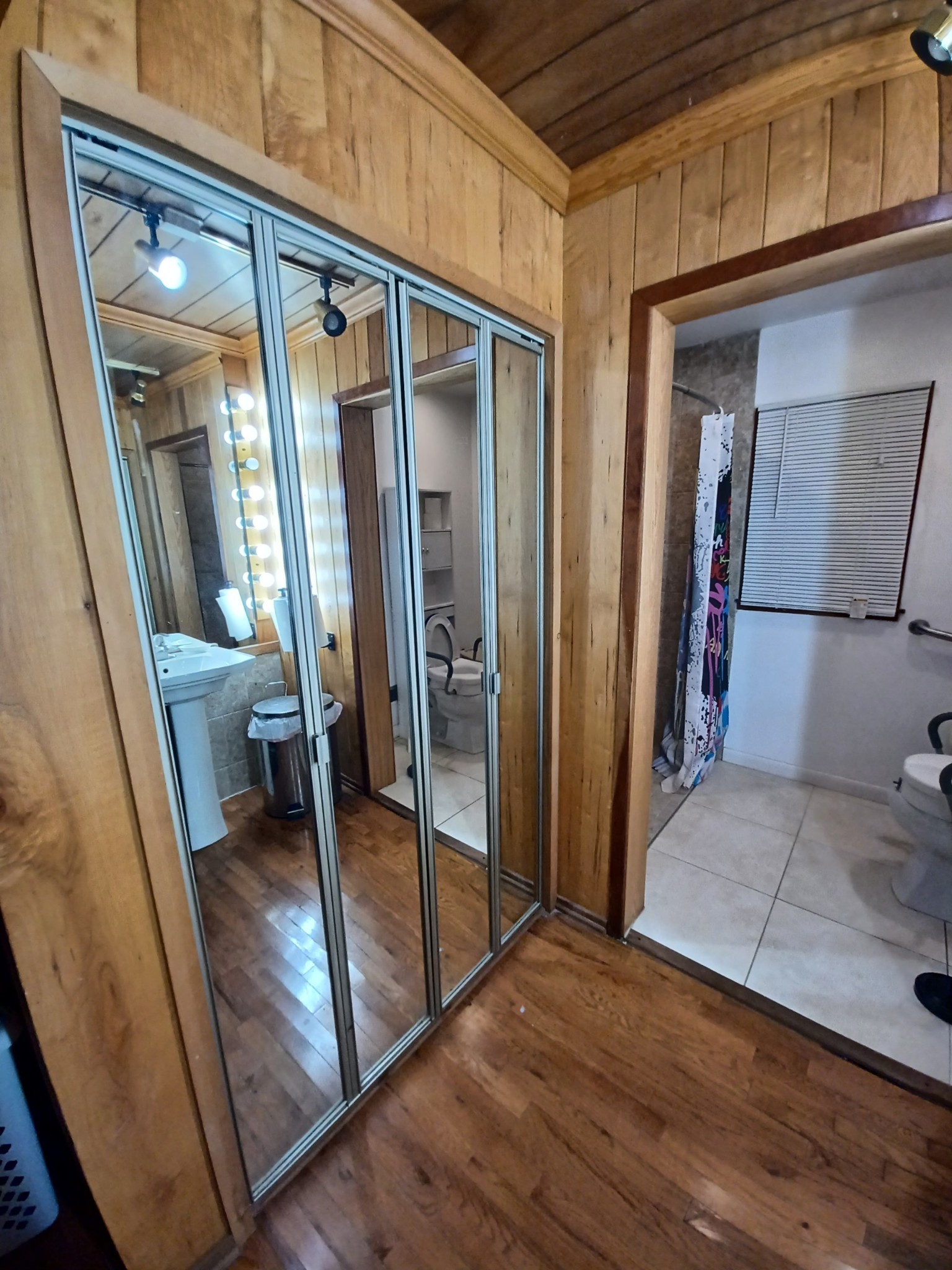 1071 Simms Heights Road Kingston Springs, TN 37082 - Photo 15 of 31 a view of a hallway with wooden floor and furniture