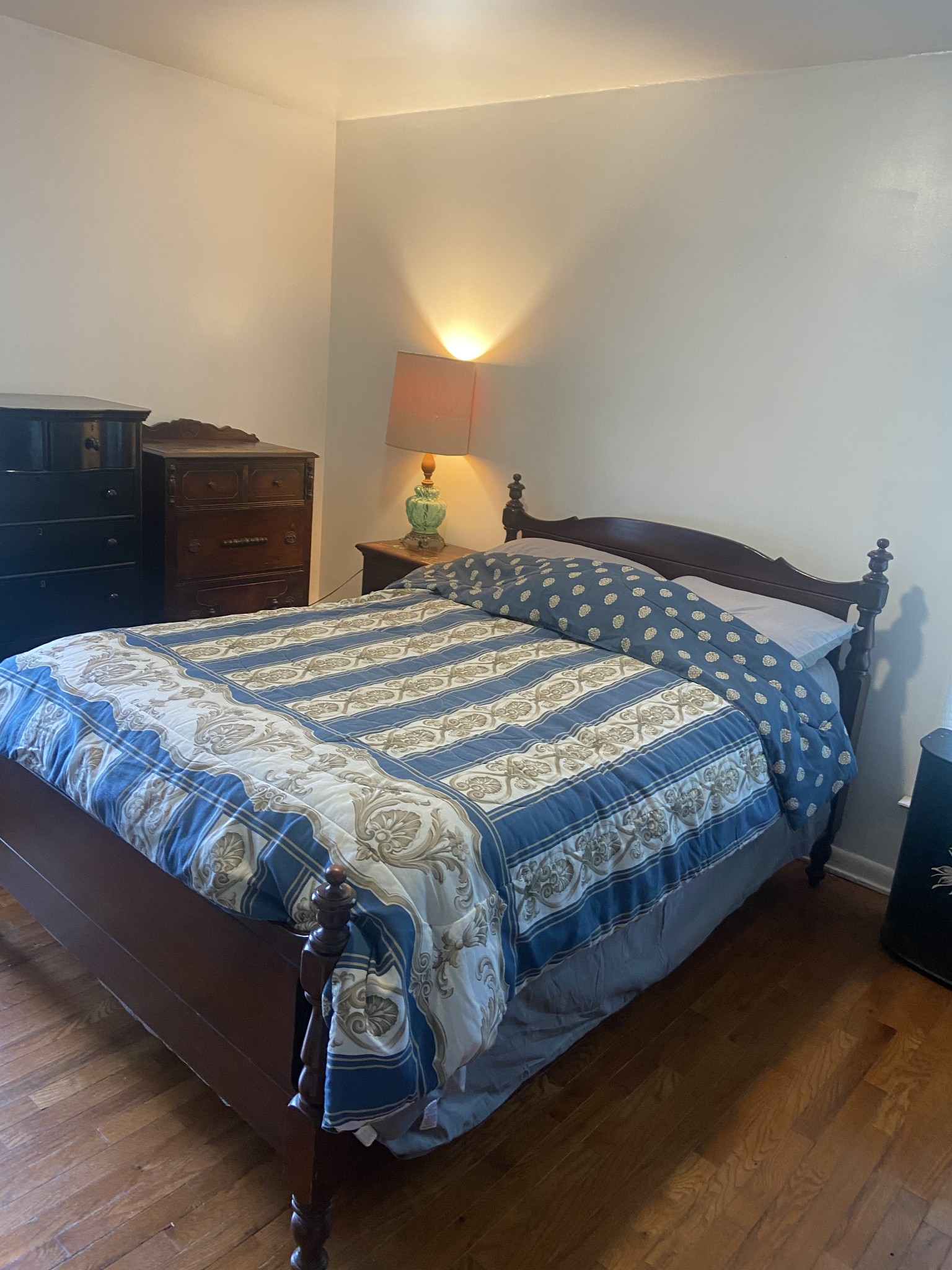 1071 Simms Heights Road Kingston Springs, TN 37082 - Photo 16 of 31 a bedroom with a bed and lamp