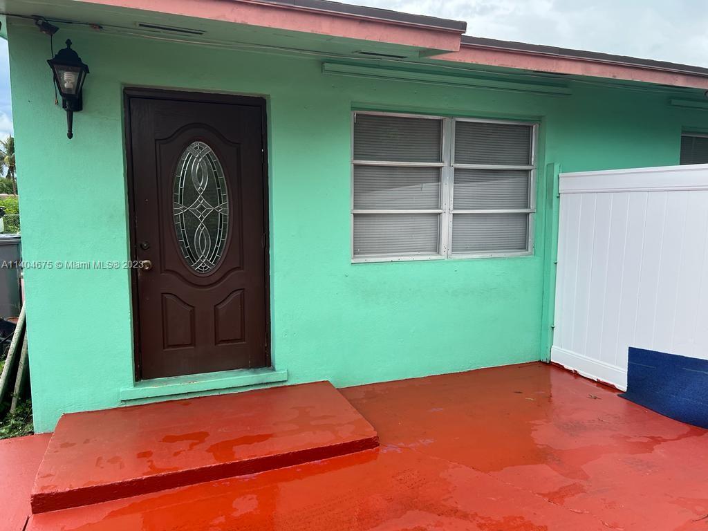 1329 Sunrise Road West Palm Beach, FL 33406 - Photo 1 of 28 a front view of a house