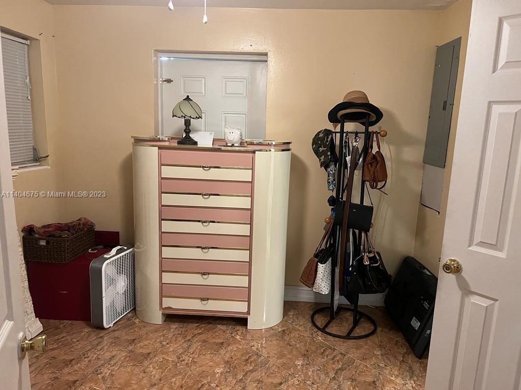 1329 Sunrise Road West Palm Beach, FL 33406 - Photo 13 of 28 a view of walk in closet with clothes