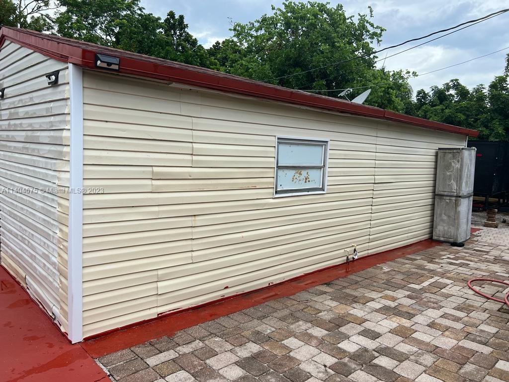 1329 Sunrise Road West Palm Beach, FL 33406 - Photo 18 of 28 a view of a backyard with a large window