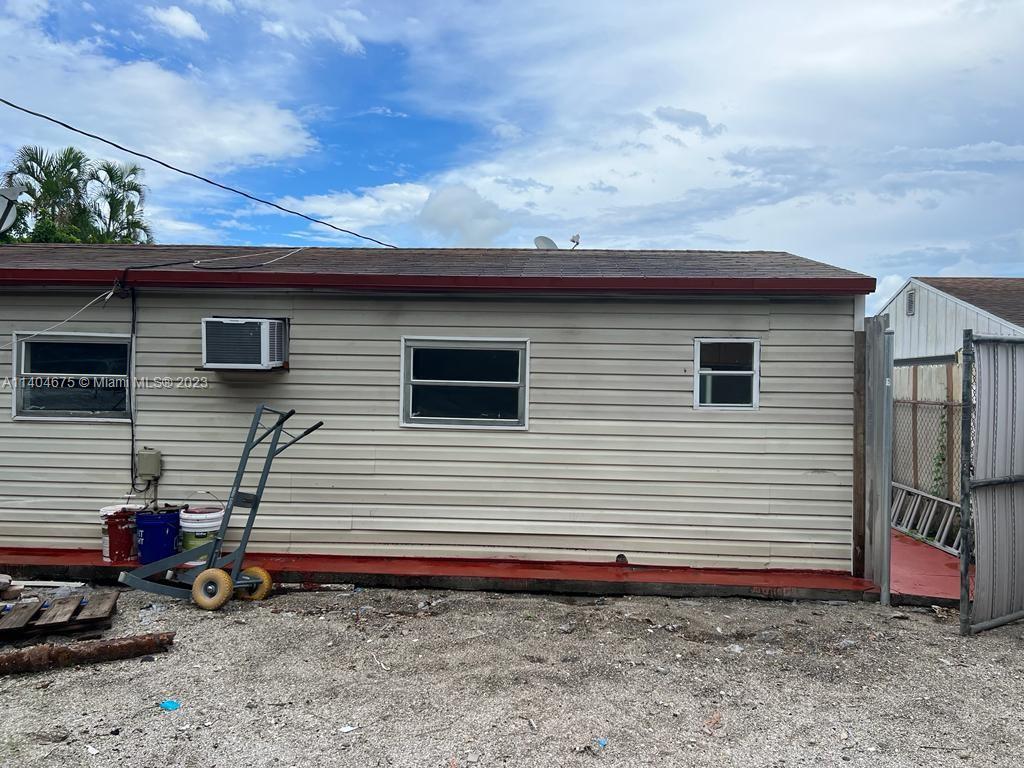 1329 Sunrise Road West Palm Beach, FL 33406 - Photo 19 of 28 a view of a house with a yard