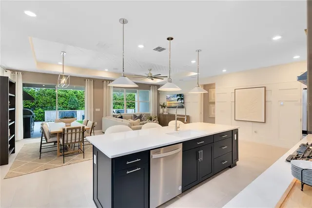 a living room with kitchen island furniture and a large window