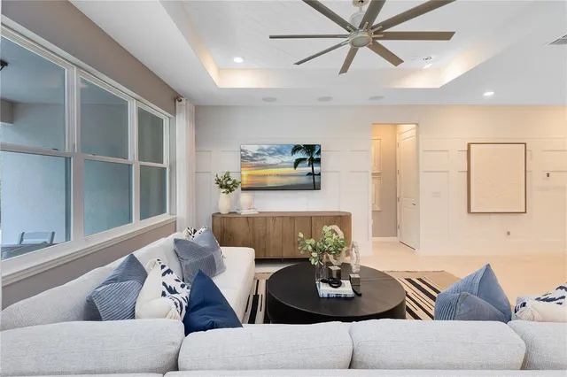 a living room with furniture and a window