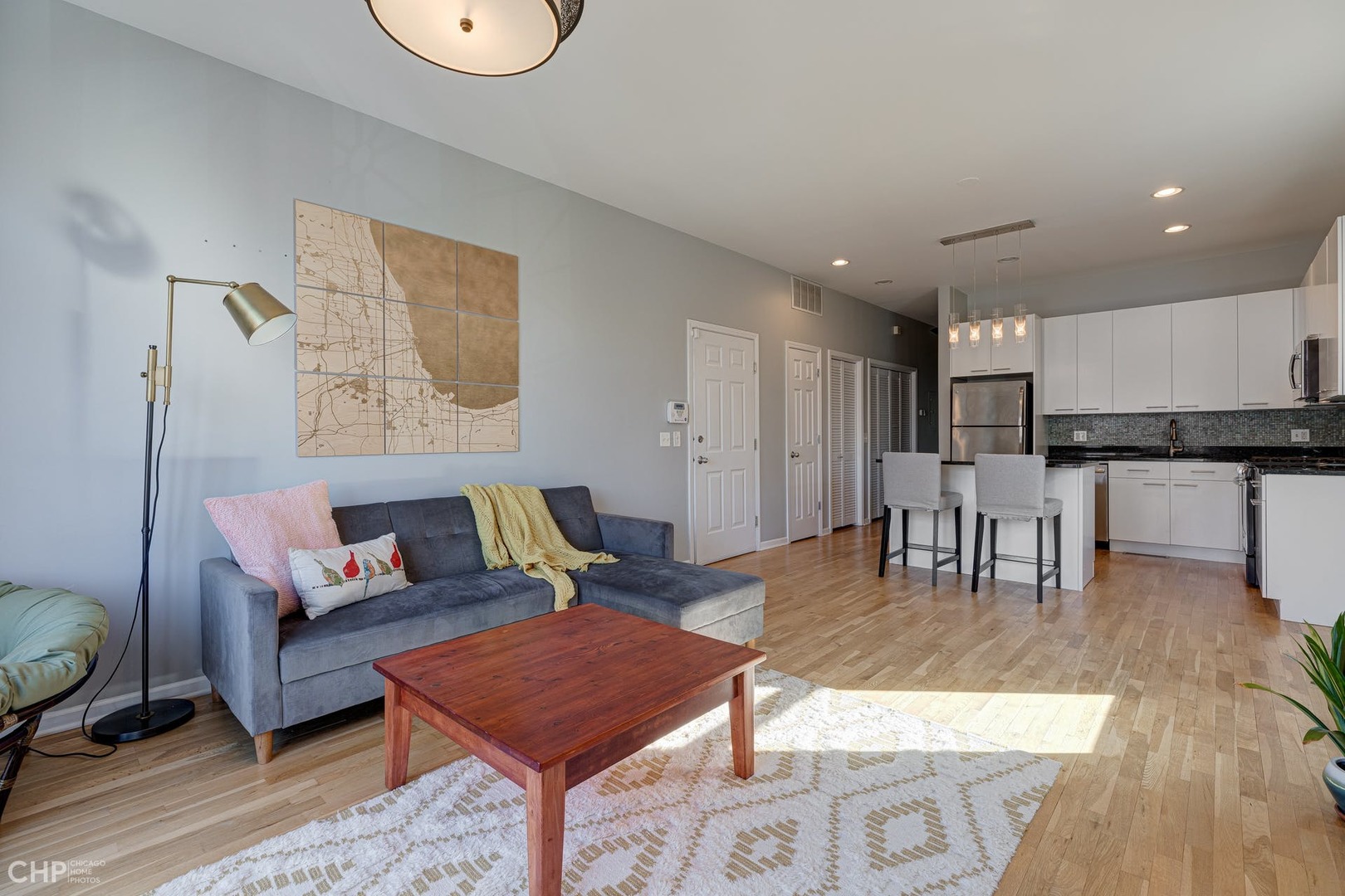 2127 West Rice Street, Unit 3W Chicago, IL 60622 - Photo 6 of 17 a living room with furniture and kitchen view