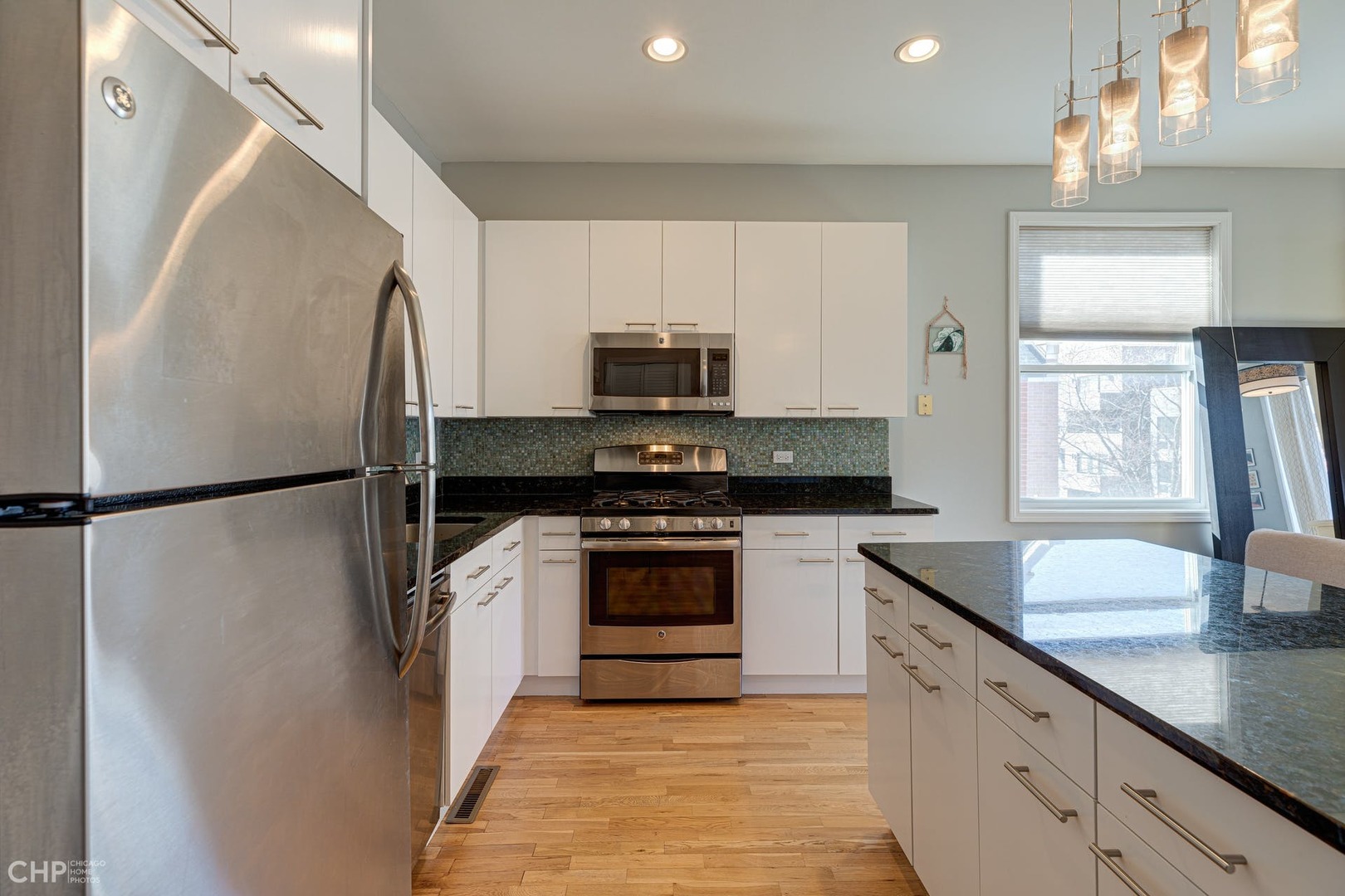 2127 West Rice Street, Unit 3W Chicago, IL 60622 - Photo 8 of 17 a kitchen with a refrigerator and a sink