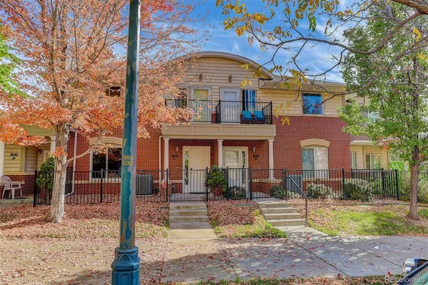 a view of empty room with fireplace and fan